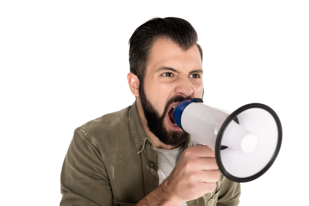Man yelling into a megaphone